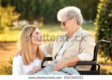 Similar – Senior dissatisfied woman in a wheelchair with her daughter