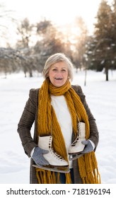 Senior Woman In Winter Nature Going Ice Skating.