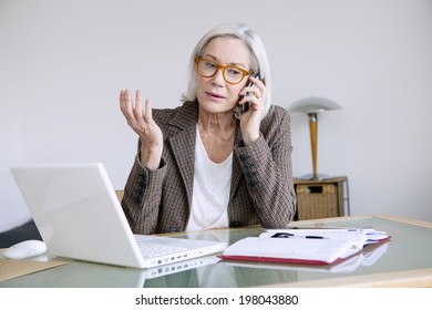 Senior Woman Working At Home.