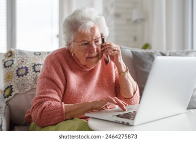 Senior woman working with laptop, shopping online, making call. Importance of digital literacy for elderly people. - Powered by Shutterstock