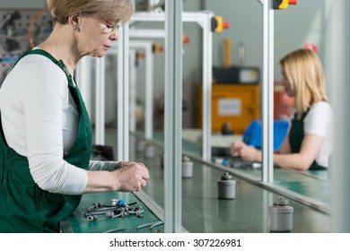 Senior Woman Is Working On Assembly Line