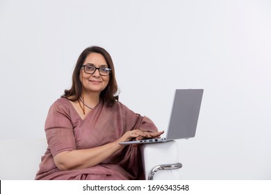 Senior Woman Working On Laptop At Home