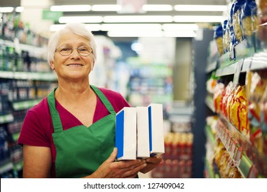 Senior Woman Working At Supermarket