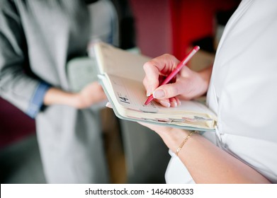 Senior Woman Writing In Notebook