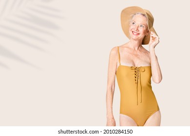 Senior Woman In Yellow Swimsuit And Sun Hat Summer Fashion