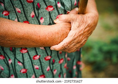 Senior Woman's Hands Close Up. Old Age Concept. Crossed Wrinkled Arms.