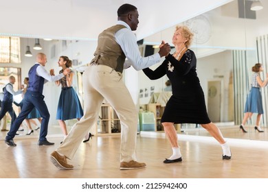 Senior WomaSenior Woman And Man Dancing Swing