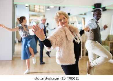 Senior WomaSenior Woman And Man Dancing Swing