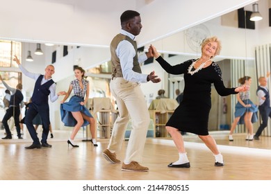 Senior WomaSenior Woman And Man Dancing Swing