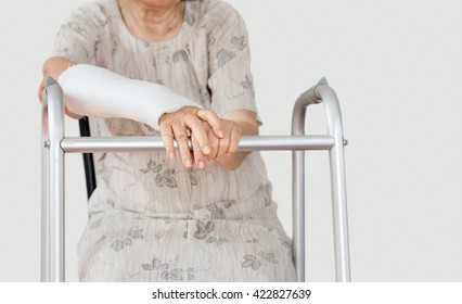 Senior Women Broken Wrist Using Walker.