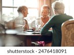 Senior women, friends and smile in restaurant for wine, vacation and retirement together with happy. Elderly people, reunion and relax in diner for drinks, holiday and social celebration with memory