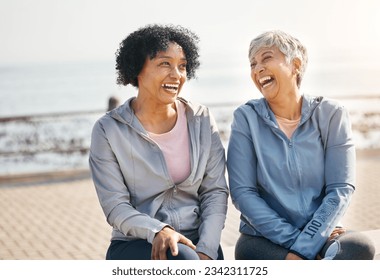 Senior women, laughing and beach with friends, training and sitting in summer outdoor. Exercise, break and mature female in the morning with funny joke and workout for wellness and health by sea - Powered by Shutterstock