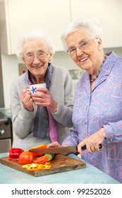 Senior Women Preparing Meal Together