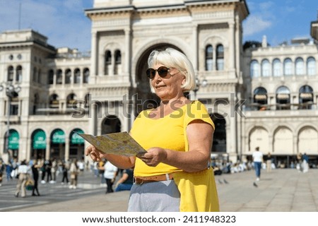 Similar – Image, Stock Photo A woman iis looking at her smartphone outdoors.