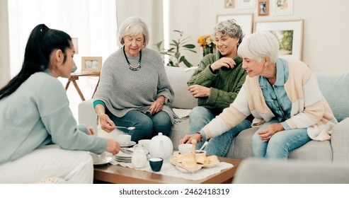 Senior women, tea and cake with friends at a retirement home for quality time, chat or relax. Elderly people or group with a caregiver at a table for food and social visit while drinking and eating - Powered by Shutterstock