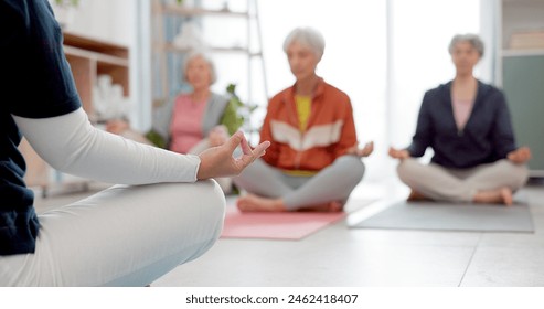 Senior women, yoga group and coach in meditation, peace and prayer hands in exercise, holistic wellness and mindfulness. Spiritual workout, class and calm elderly people, clients and personal trainer - Powered by Shutterstock