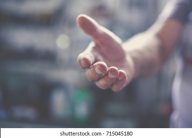Senior worker provides hand. Close up. - Shutterstock ID 715045180