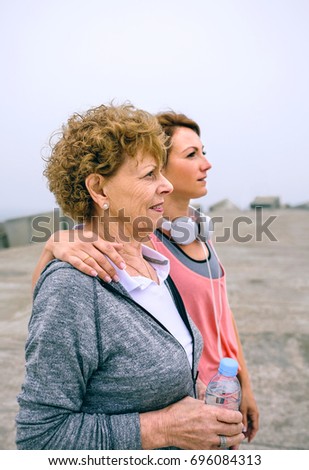 Image, Stock Photo Senior and young sportswoman looking away