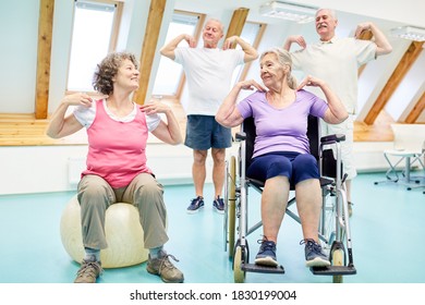 Seniors do exercises for the healthy back in the physiotherapy - Powered by Shutterstock