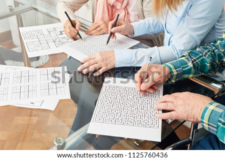 Seniors do memory training with maze against dementia disease
