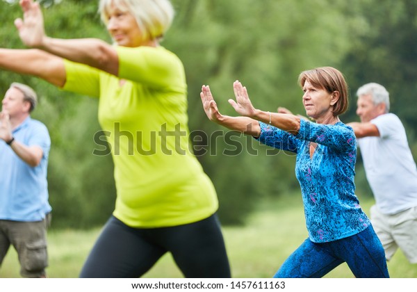 Seniors do Qi Gong or Tai Chi exercise for\
relaxation and health