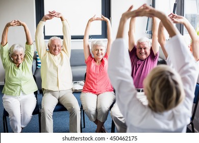 Seniors Doing Exercises In A Retirement Home