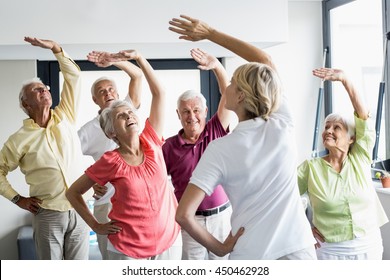 Seniors Doing Exercises In A Retirement Home