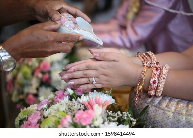 The Seniors And Guests From Older To Younger Age Pour The Holy Water From A Conch Shell To Bless The Groom And The Bride.