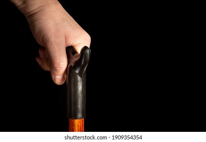 Senior'S Hand Walking With Cane Close Up On Black Isolated Background