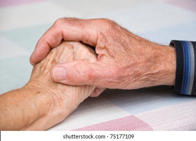 seniors holding hands in happy atmosphere