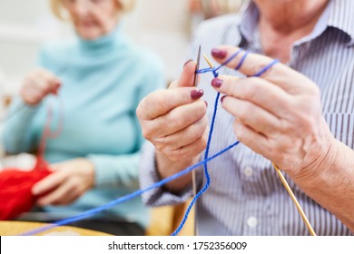 Seniors Learn To Crochet Or Knit In A Knitting Club Or Handicraft Workshop