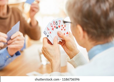 Seniors Play Cards In Their Free Time Or In A Tournament In The Retirement Home