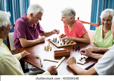 Seniors Playing Games In A Retirement Home