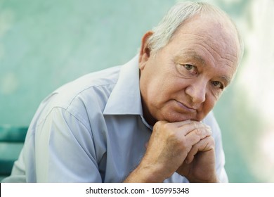 Seniors Portrait Of Contemplative Old Caucasian Man Looking At Camera. Copy Space