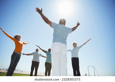 Seniors practicing yoga under sunny blue sky - Powered by Shutterstock