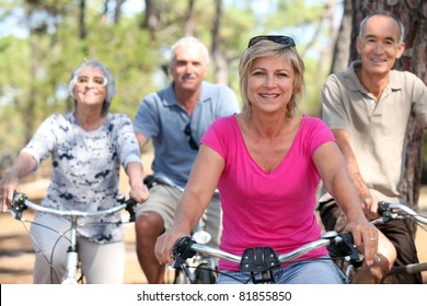 seniors riding bicycles in the park - Powered by Shutterstock