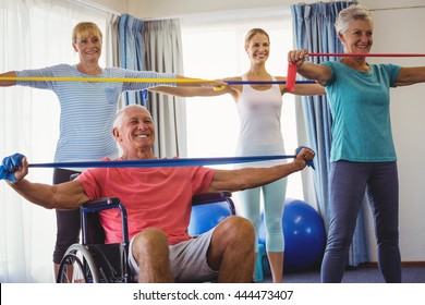 Seniors stretching during fitness class in retirement house