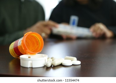 Seniors taking pills - Powered by Shutterstock