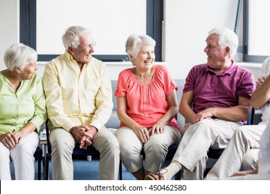 Seniors Talking To Each Other In A Retirement Home