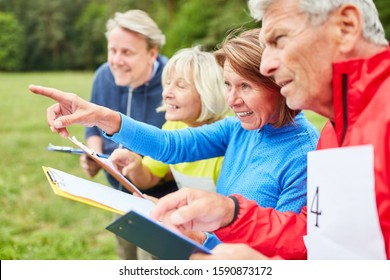 Seniors Team In A Scavenger Hunt Solves Tasks In Nature Together