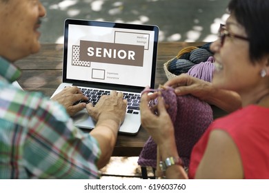 Seniors working on laptop network graphic overlay - Powered by Shutterstock