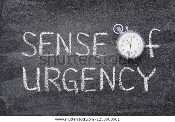 sense of urgency phrase\
handwritten on chalkboard with vintage precise stopwatch used\
instead of O