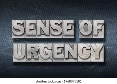 sense of urgency phrase made from metallic letterpress on dark jeans background - Shutterstock ID 1968873181