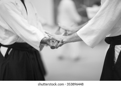 Sensei Giving A Sword To His Senior Student