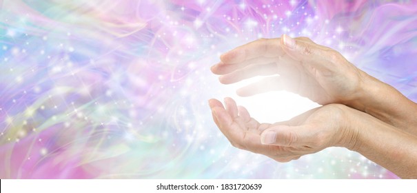 Sensing Awesome Metaphysical Energy Field between hands - female cupped hands with white healing energy against a colourful blue purple green sparkling chaotic background with copy space 
 - Shutterstock ID 1831720639