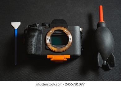 Sensor cleaning on a mirrorless camera, close up photo. 