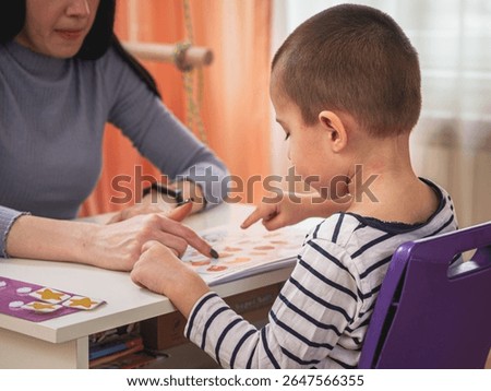 Sensory Integration Therapy Neurocorrection Session for Child with Specialist, Mom is working with her son
