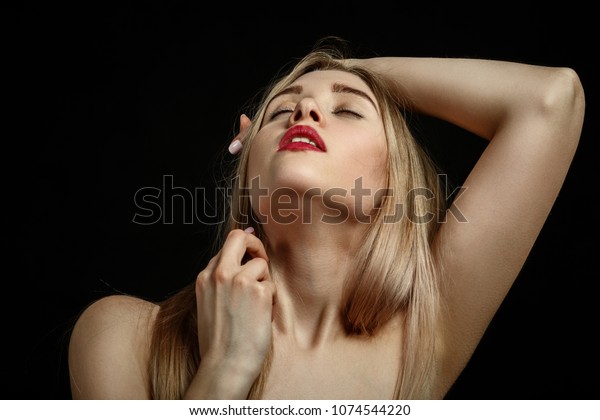 Sensual Aroused Blond Woman With Closed Eyes On Black Background
