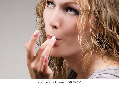 Sensual Blond Girl Licking Fingers