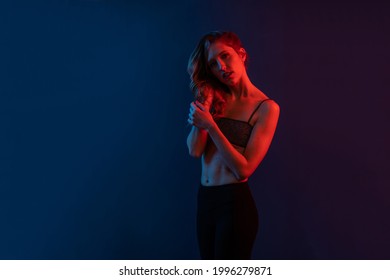 Sensual Blonde Woman Studio Portrait With Copy Space. Colored Gel Photography.